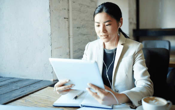 Woman looking at the screen of a tablet