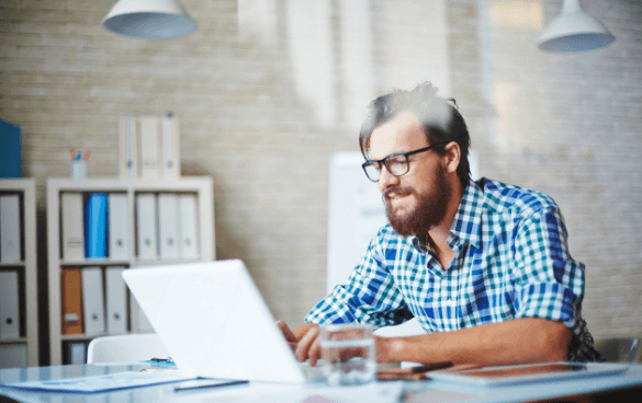 Man looking at his laptop