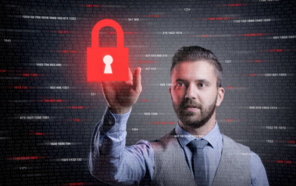 A man in a business suit appears to hold a large red padlock superimposed on his hand against a backdrop of digital data, symbolizing cybersecurity or data protection.