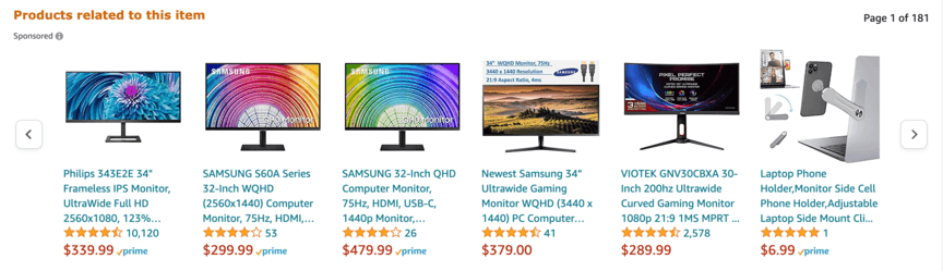 Sponsored product listings showing a variety of computer monitors from brands like Philips, Samsung, and Viotek, with prices ranging from $6.99 to $479.99, and a laptop phone holder accessory.