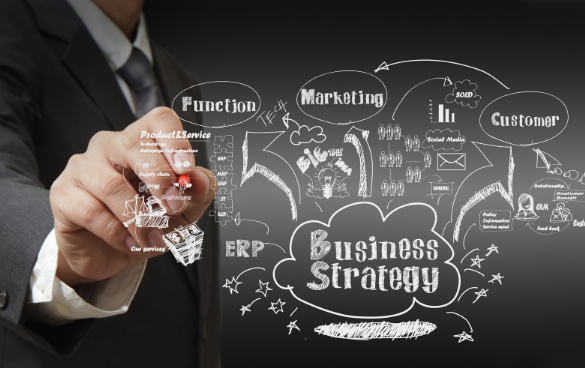 A person in a business suit is drawing a detailed business strategy flowchart on a transparent board, including elements like marketing, customer engagement, and ERP.