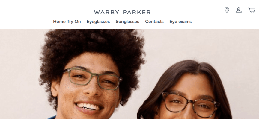 Warby Parker's website featuring two people modeling glasses