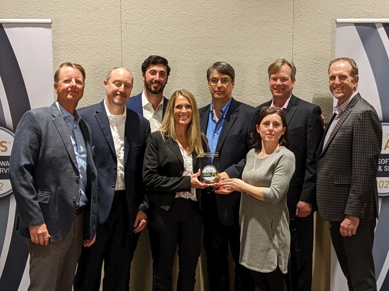CenTrak leaders holding an award