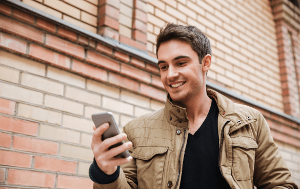 Man on a cell phone browsing online