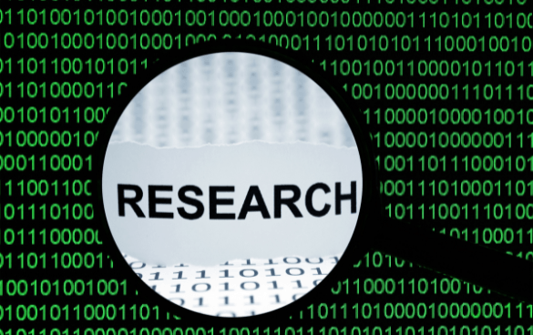 Magnifying glass over the word research