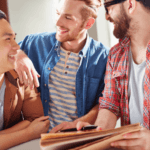 Three guys laughing and talking