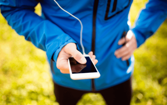 Woman in workout clothes scrolling through her phone