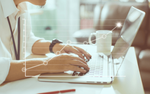 Person in a white shirt typing on a laptop with a coffee cup and smartphone on the table, overlaid with a data analysis chart graphic.