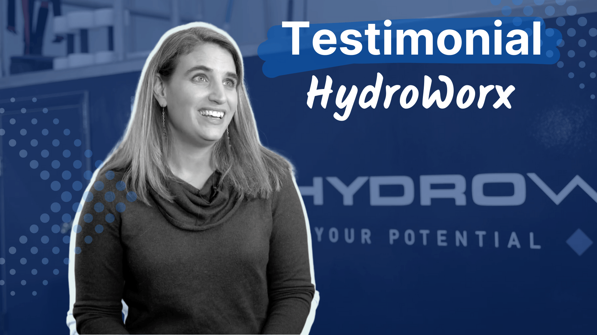 Smiling woman in a dark top with a scarf in front of a blue background with the text 'Testimonial HydroWorx' and the HydroWorx logo.