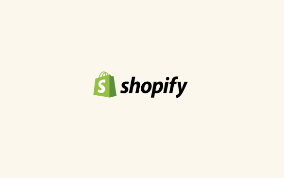 Shopify logo with a green shopping bag icon and the word 'shopify' in lowercase letters.