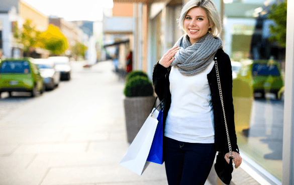 Woman standing outside of a store