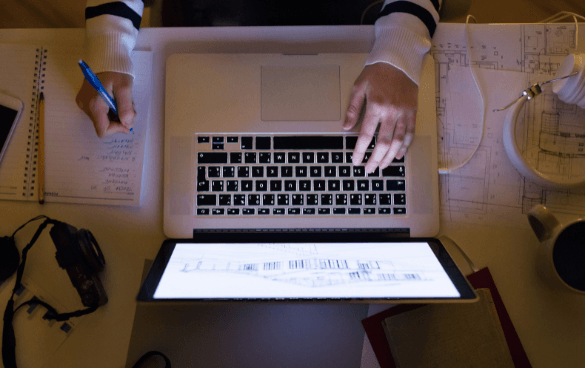 Woman typing on a laptop