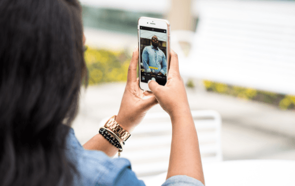 woman filming video on phone