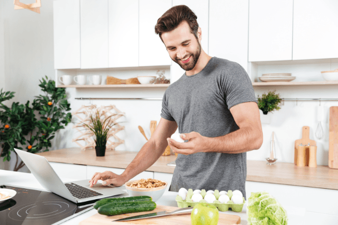 man cooking healthy food