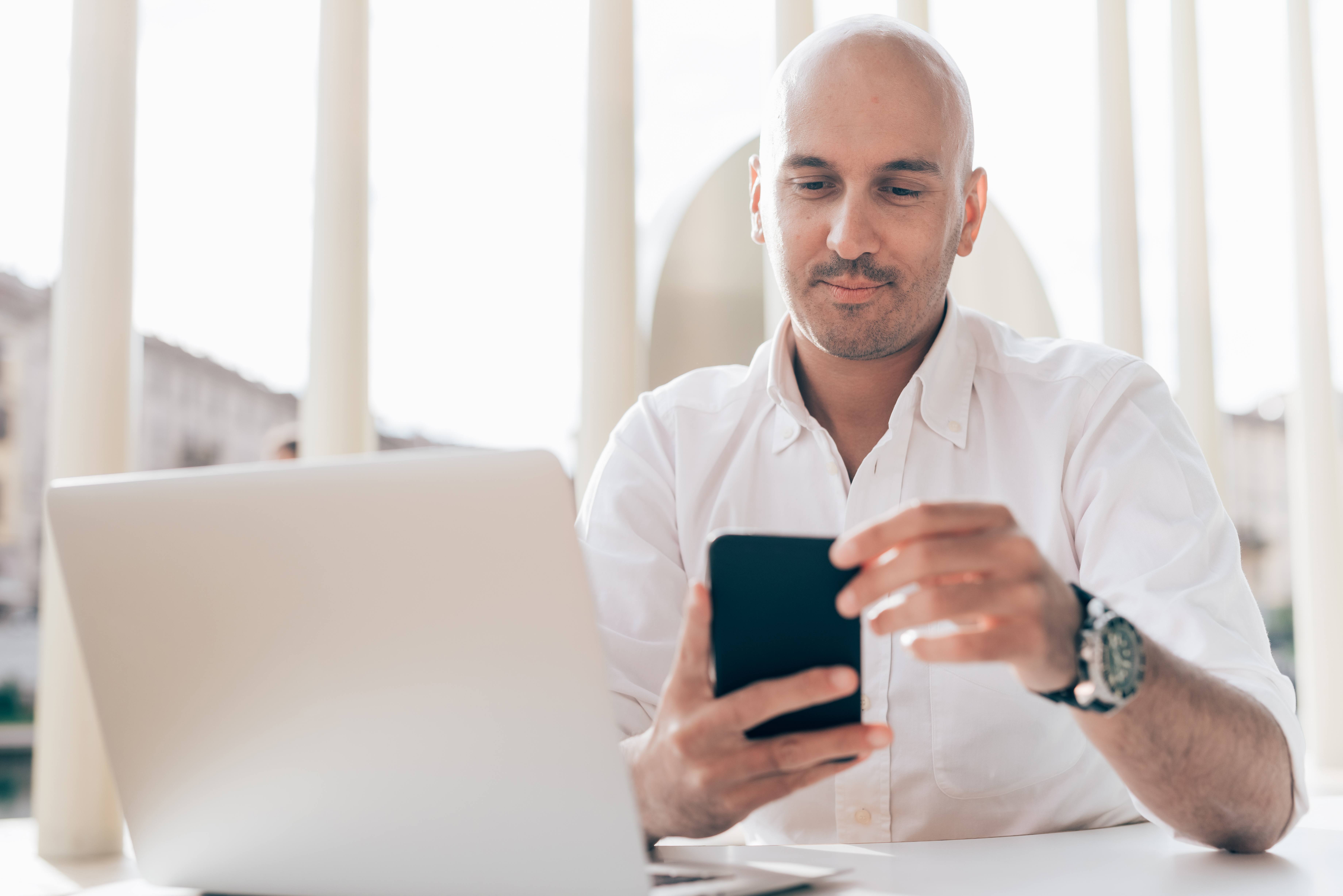 Young contemporary businessman remote working sitting 