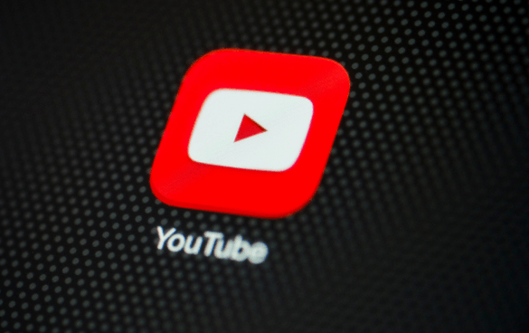 Close-up of the YouTube logo with the red play button and the word 'YouTube' in white.