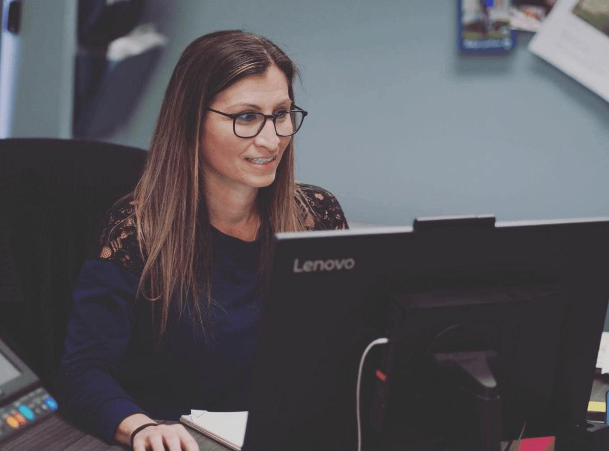 Boss Mechanical team member on a computer