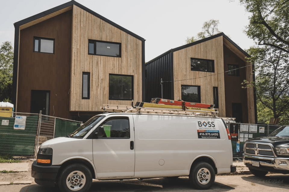 Boss Mechanical van parked outside a house