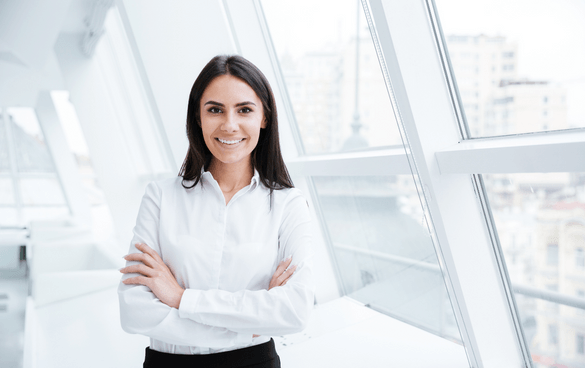 Business woman standing with her arms crossed