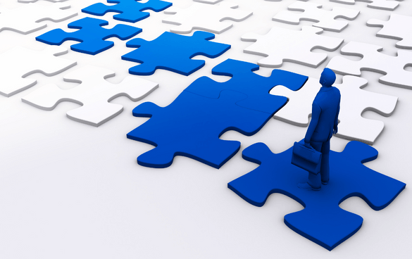 A 3D-rendered figure in a suit holding a briefcase stands on a large blue puzzle piece, surrounded by white puzzle pieces on the floor, symbolizing problem-solving or decision-making in a business context.