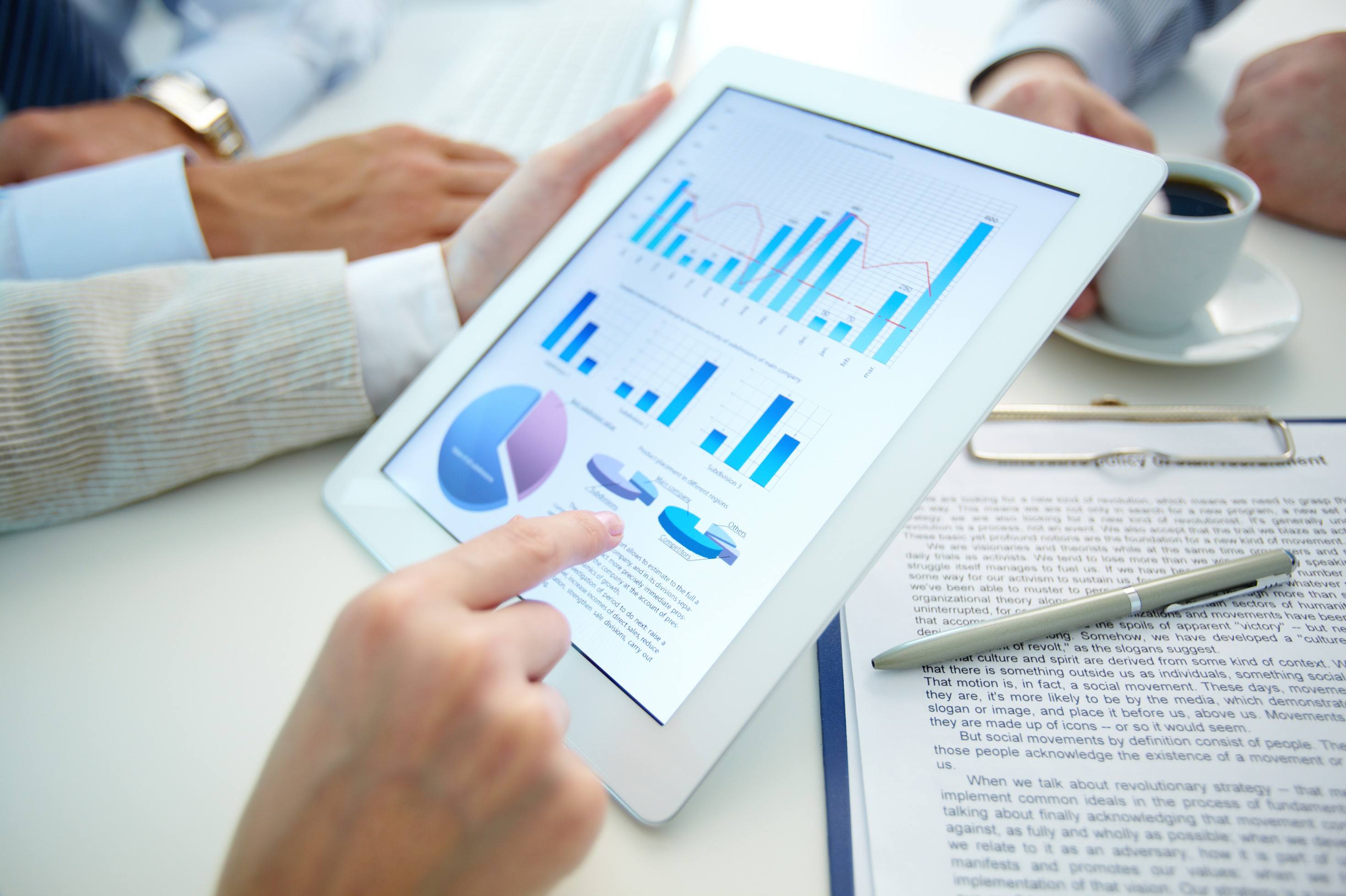 business document in touchpad held by female during explanation