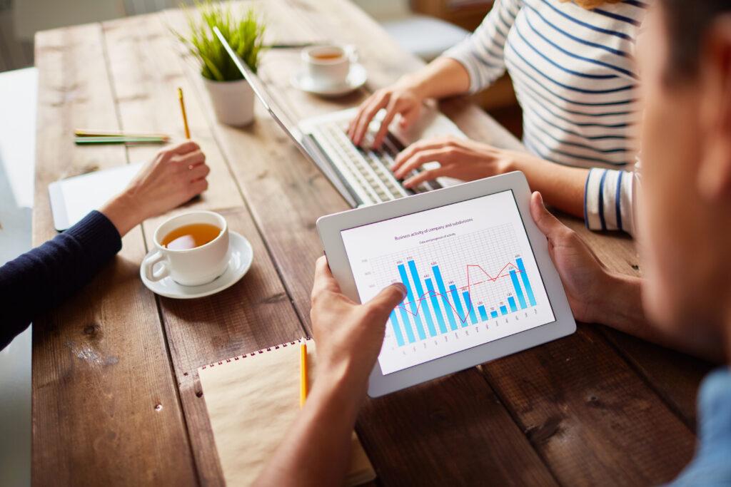 Businessperson studying electronic data in digital tablet