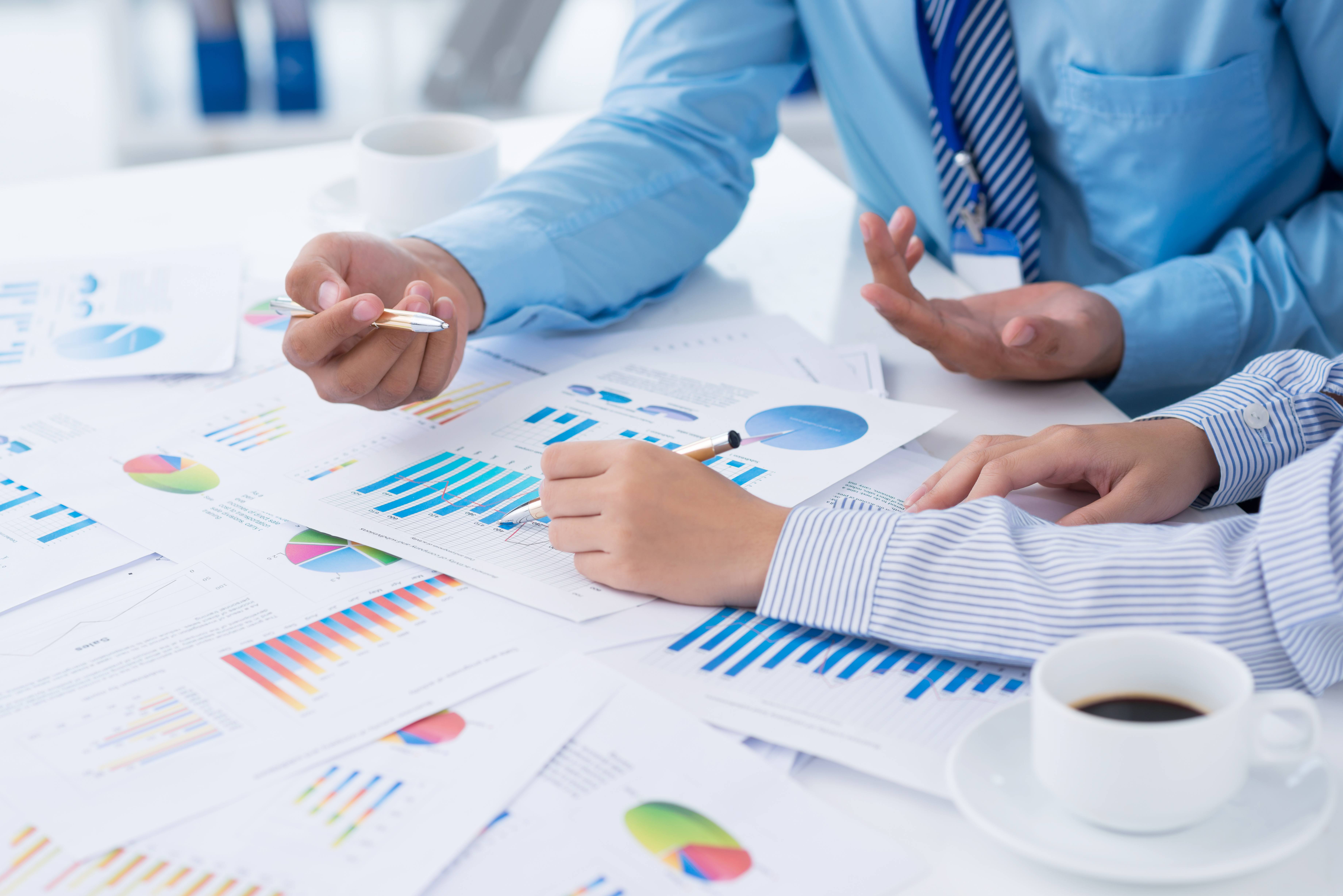 Cropped image of business people discussing business strategy on the foreground