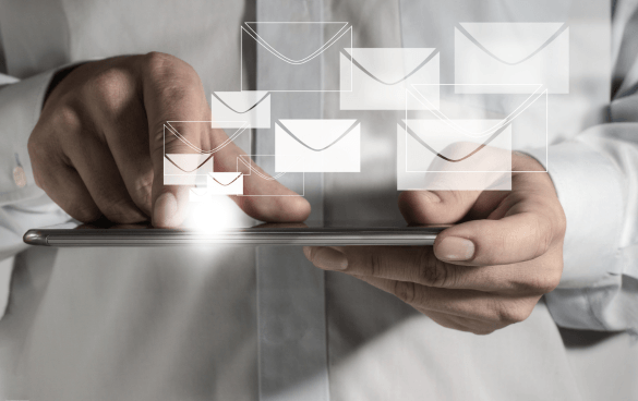 Man sending an email on a tablet