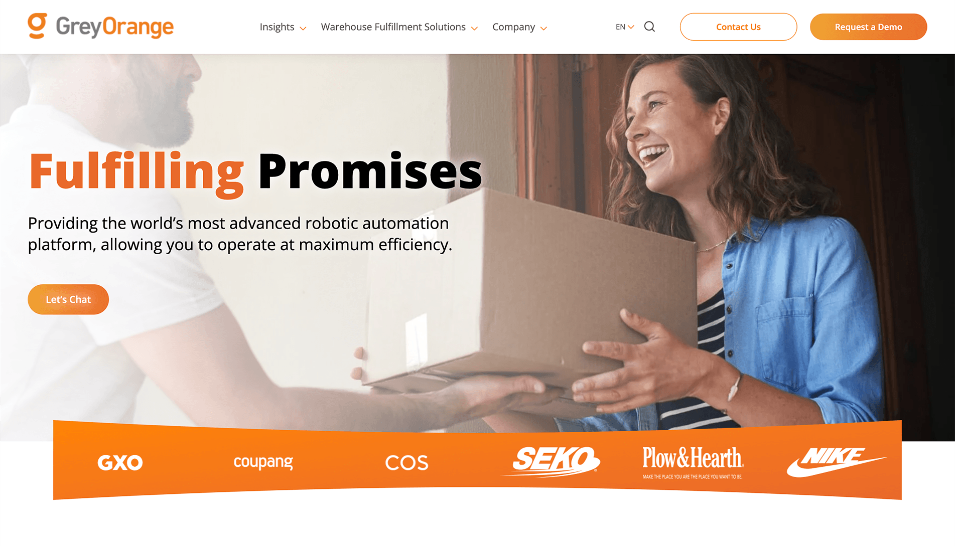 A man delivering a package to a happy woman at her doorstep, with the text 'Fulfilling Promises' and a subtitle about GreyOrange's robotic automation platform. Company logos including GXO, Coupang, COS, SEKO, Plow & Hearth, and NIKE are displayed below.