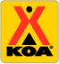 Logo of Kampgrounds of America (KOA) featuring a yellow background with a red tepee design above the letters 'KOA'.