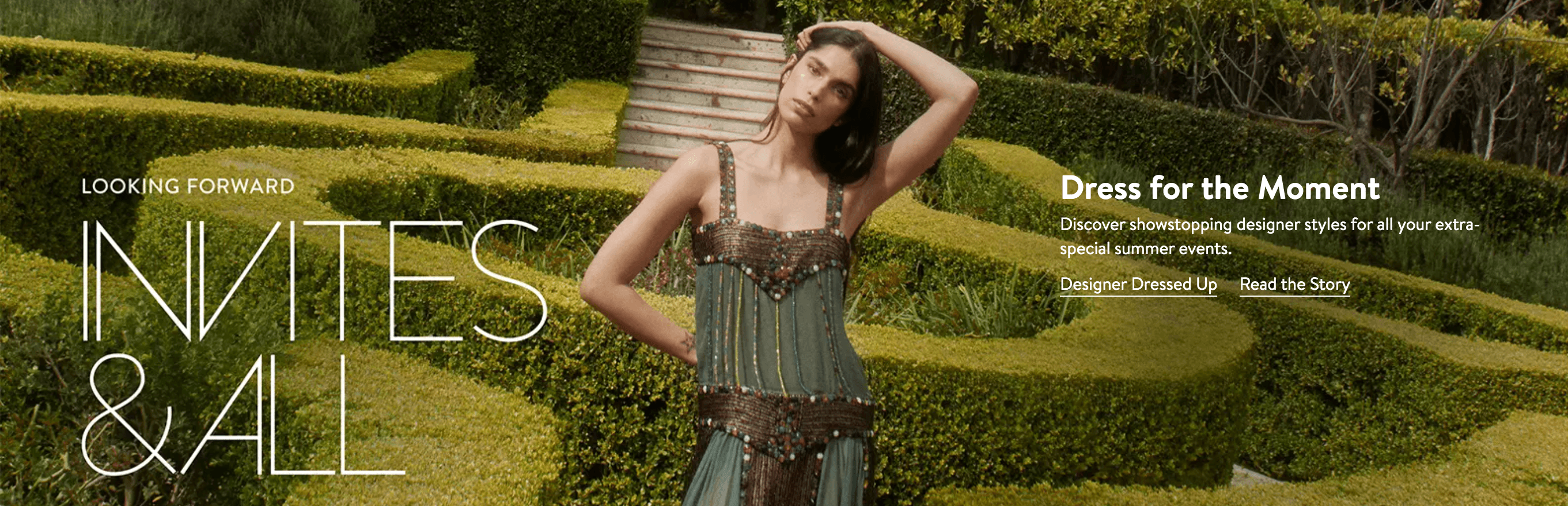 Image of a woman standing in a grass maze modeling a green dress