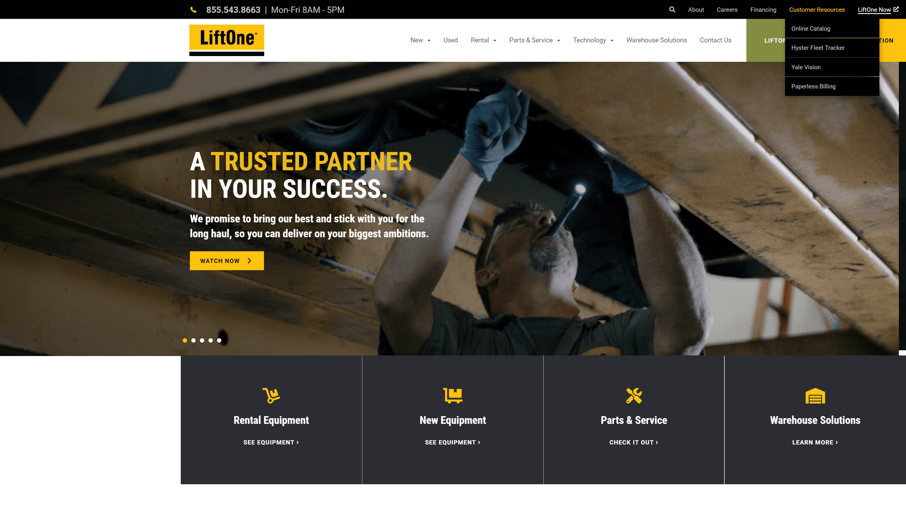 A technician working on machinery as part of LiftOne's industrial services advertisement on their website.