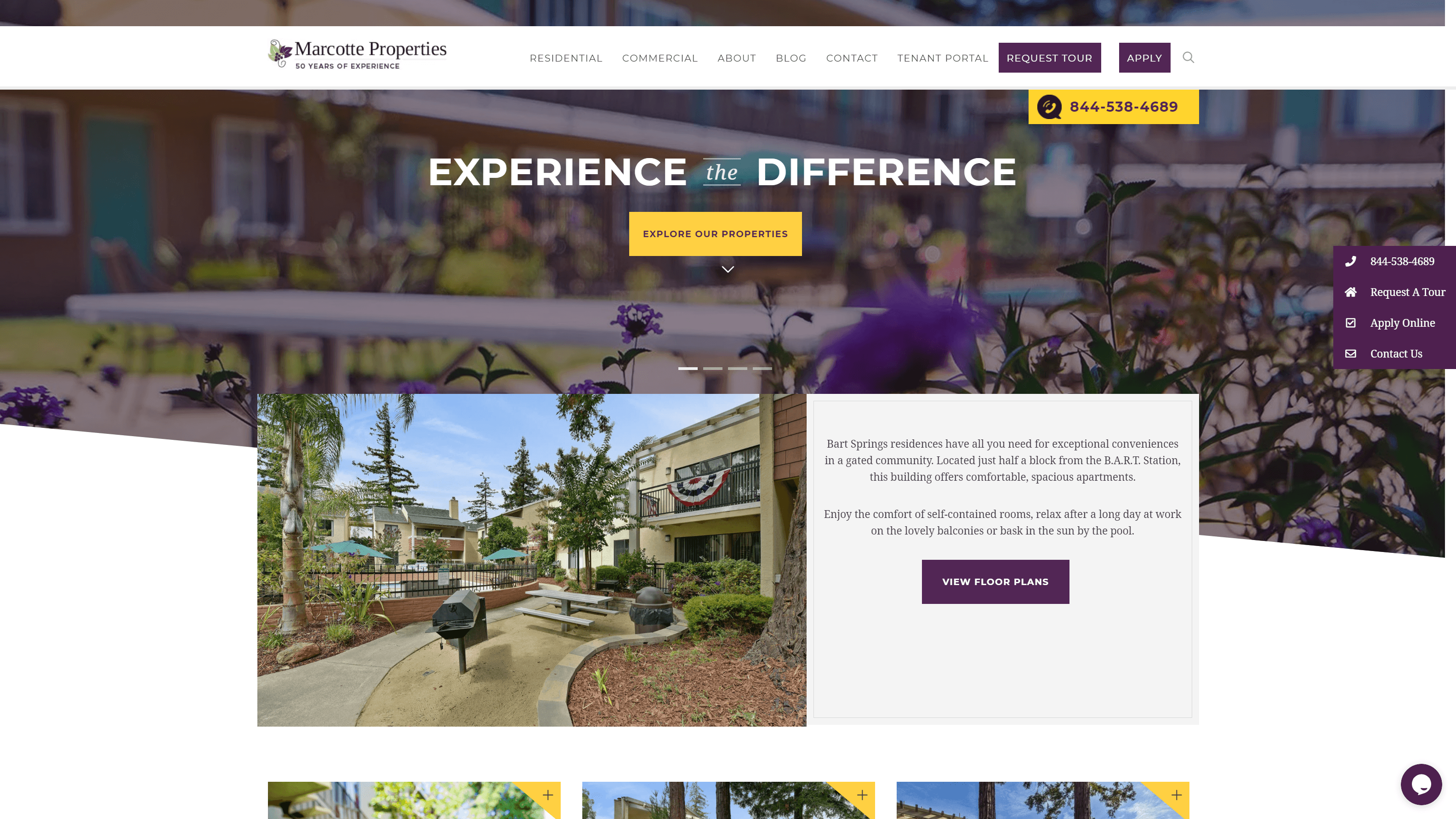 Screenshot of Marcotte Properties real estate website featuring a navigation bar, a banner with the slogan 'EXPERIENCE the DIFFERENCE', and a description of Bart Springs residences with a 'VIEW FLOOR PLANS' button, set against a blurred background of a residential building.