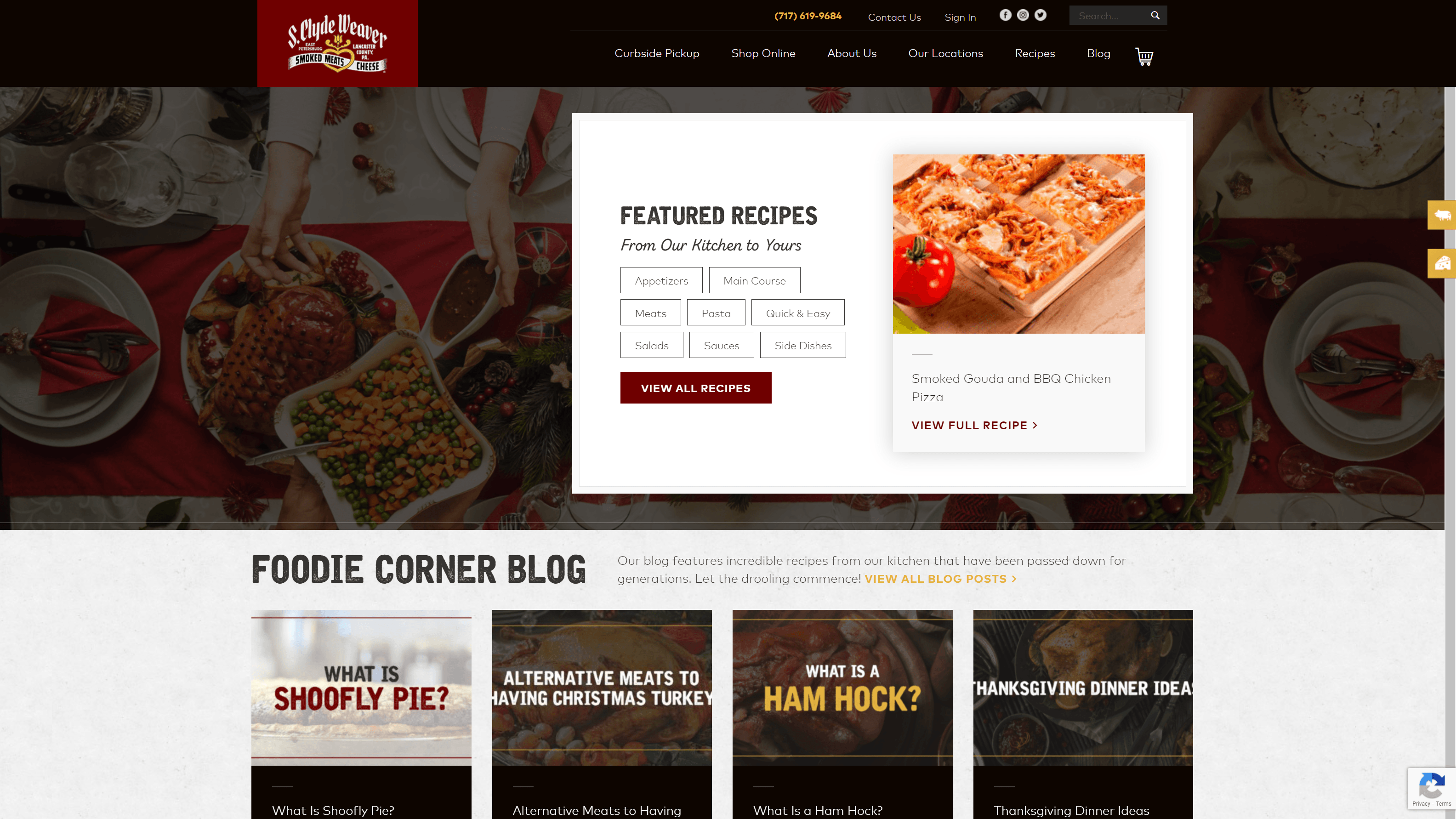 Screenshot of S. Clyde Weaver's website featuring a navigation bar, a festive dining table background, and sections for featured recipes and foodie blog posts with titles and images of various dishes.