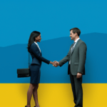 Woman in a business outfit shaking a man in a business suite's hand