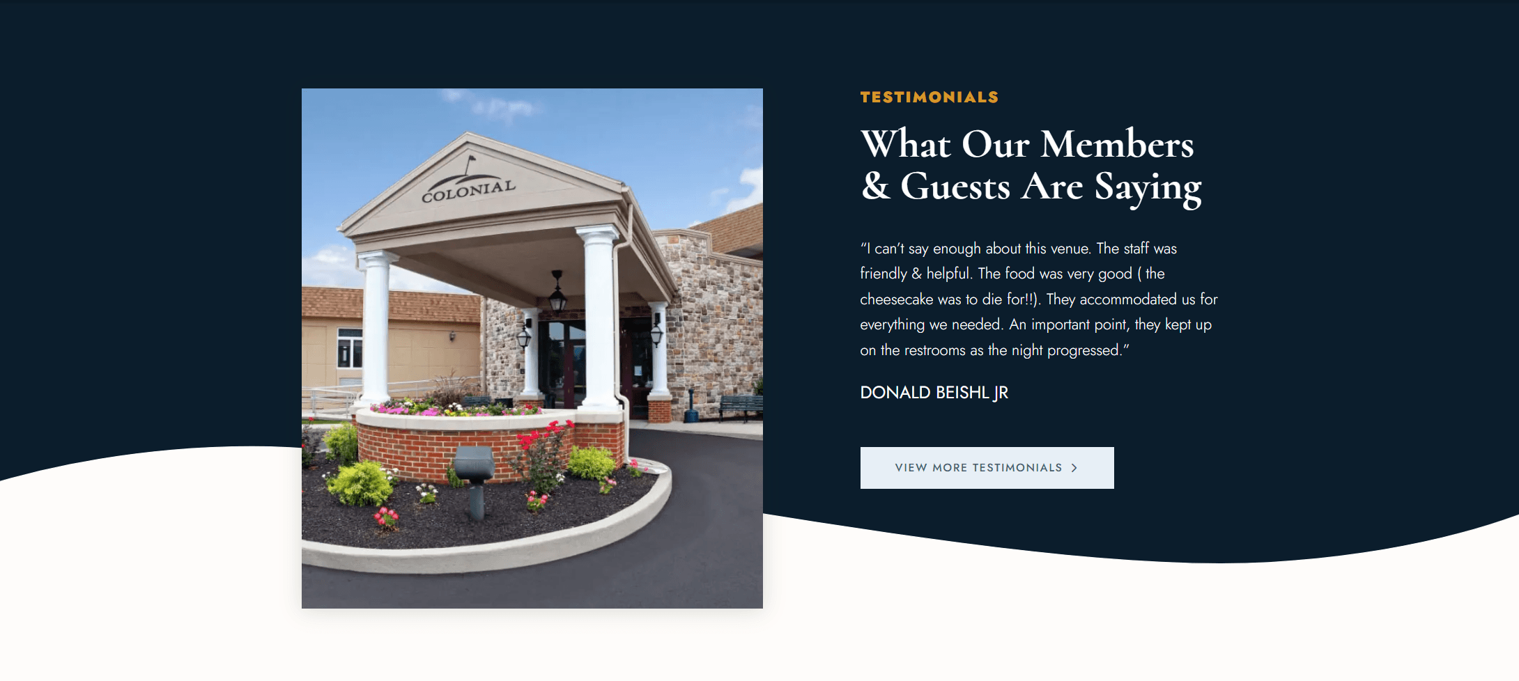 Exterior of the Colonial building with a covered entrance and flower beds, alongside a testimonial about the venue's service and food.