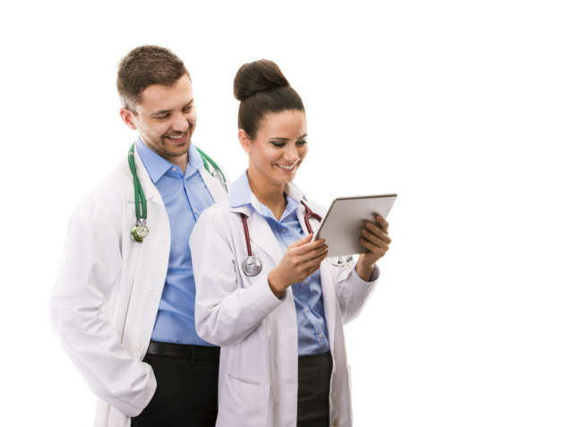 Two healthcare professionals, a man and a woman, in white lab coats and stethoscopes, are looking at a tablet screen together with engaged expressions.