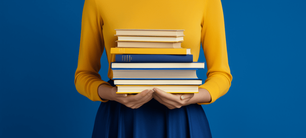 Woman holding a stack of books