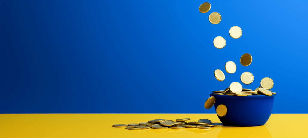 Coins falling into a blue bowl
