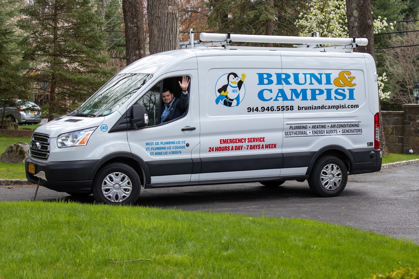 white van with a bruni & campisi pengin logo parked in a driveway