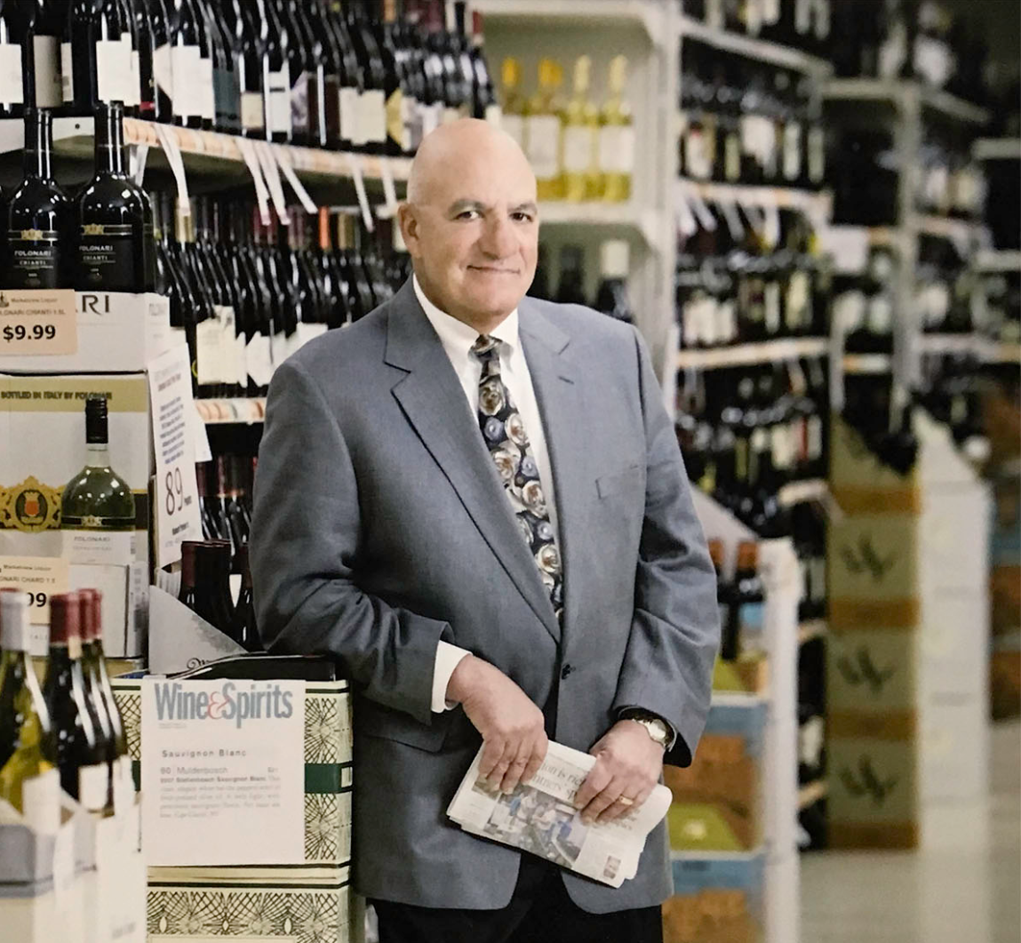 the owner of marketview liquor standing in the store