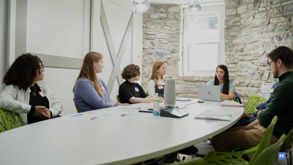 group of people sitting at a table