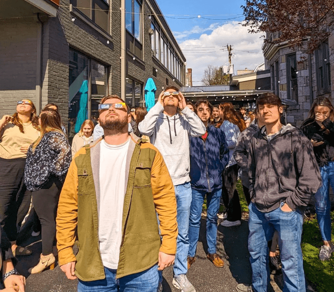 Group of people watching the solar eclipse