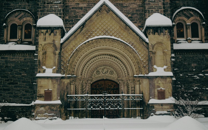 Facade of University College on Winter Day, University of Toronto, Canada